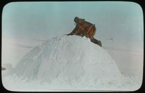 Image of Man On Top of Snow-house